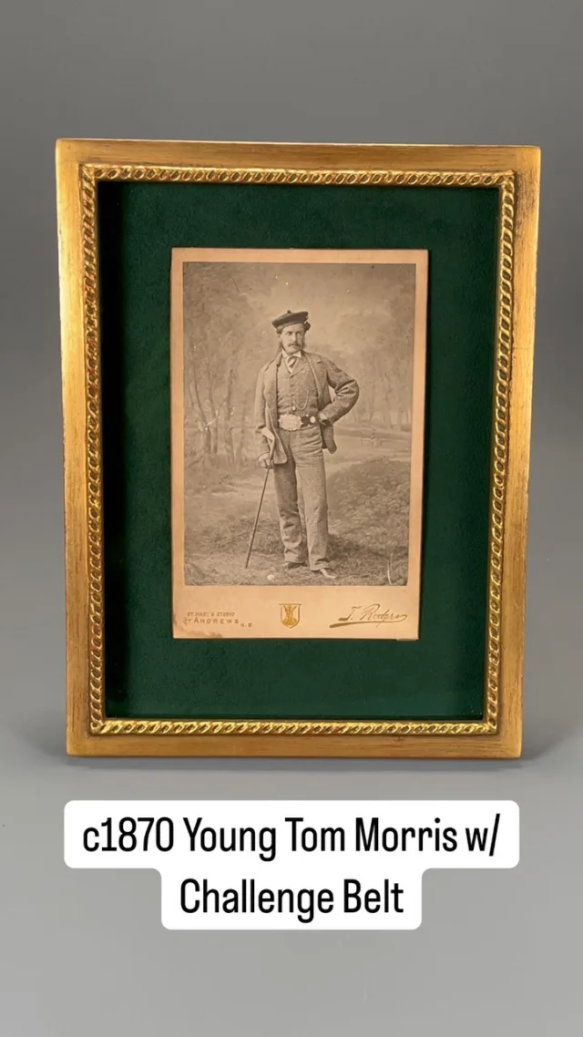 One of golf photography’s Holy Grails. An original cabinet card photograph of Young Tom Morris posing with the Open Championship Challenge Belt (predecessor to the Claret Jug). Historians have long debated when this photo was taken, though current scholarship dates it to the days following Tommy’s 1870 Open Championship victory. This was Young Tom’s 3rd consecutive victory, which allowed him to keep the Challenge Belt for good. That would make the young golf prodigy only 19 years old at the time of this photograph. Taken by famed St Andrews photographer Thomas Rodger in his St Andrews studio.