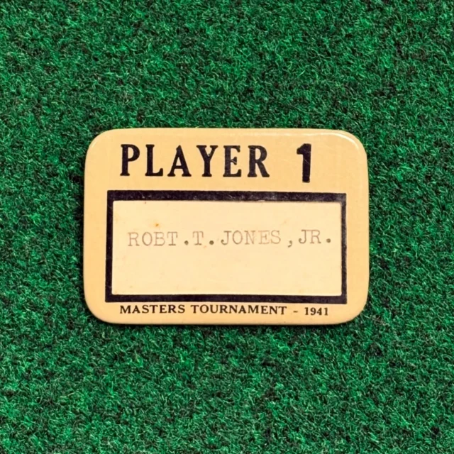 Bobby Jones’ actual 1941 Masters player badge. That year, Jones was Player 1, an honor later bestowed upon the defending Masters Champion. Very few pre-World War II player badges from the Masters are known to exist, making this badge from the Masters and Augusta National founder without question the finest Masters player badge in existence. 

Currently featured in Lot 6 of our Premier Auction.